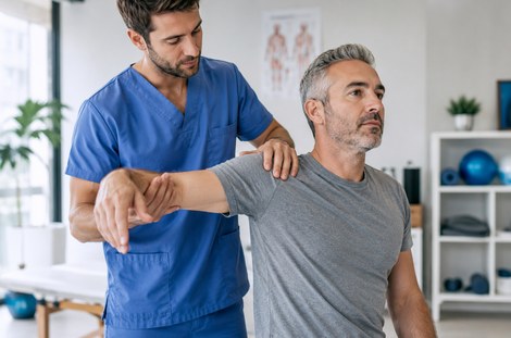 Physiotherapist treating a patient
